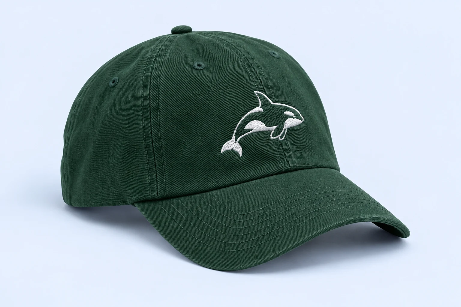 Forest green cap with embroidered orca